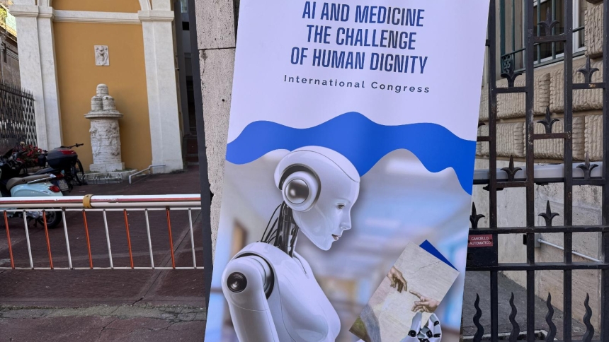 The poster for the international congress, "AI and Medicine: The Challenge of Human Dignity," sponsored by the Pontifical Academy for Life and the International Federation of Catholic Medical Associations, is seen Nov. 10, 2025, outside the Jesuit headquarters in Rome where the congress was being held. (CNS photo/Cindy Wooden)