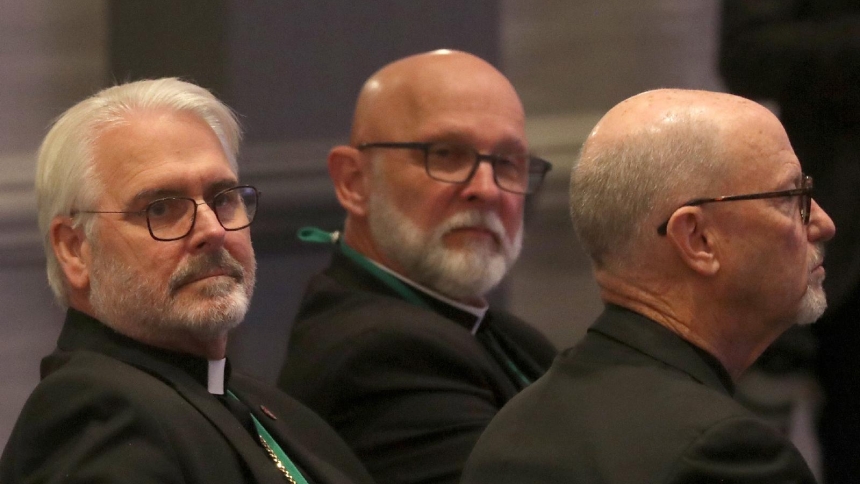 Archbishop Paul S. Coakley of Oklahoma City, left, looks on moments after being elected president of the U.S. Conference of Catholic Bishops during a Nov. 11, 2025, session of the fall general assembly of the USCCB in Baltimore. His three-year term begins at the close of the Nov. 11-13 plenary. (OSV News photo/Bob Roller)