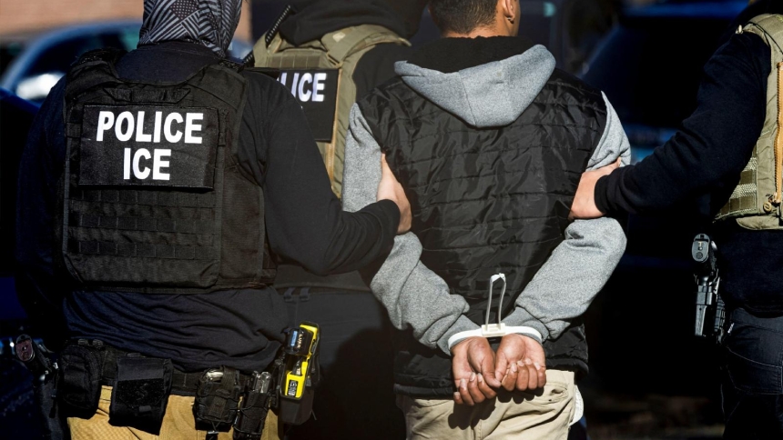 Agents with the Immigration and Customs Enforcement detain a man after conducting a raid at the Cedar Run apartment complex in Denver Feb. 5, 2025. (OSV News photo/Kevin Mohatt, Reuters)