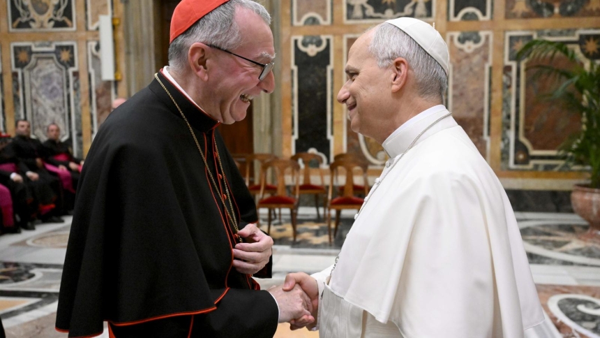 Pope Leo XIV greets Cardinal Pietro Parolin, Vatican secretary of state, during a meeting at the Vatican with priests who staff nunciatures and other Vatican diplomatic missions around the world Nov. 17, 2025. (CNS photo/Vatican Media)