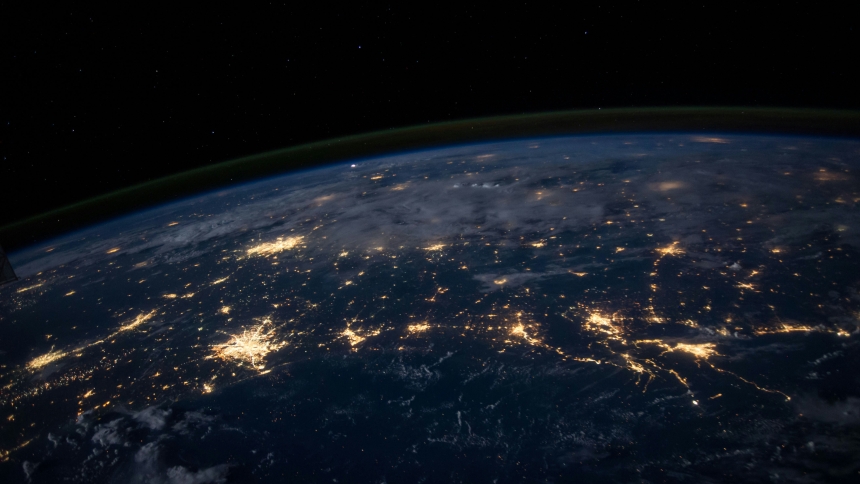 A photo of earth from space with visible lights 