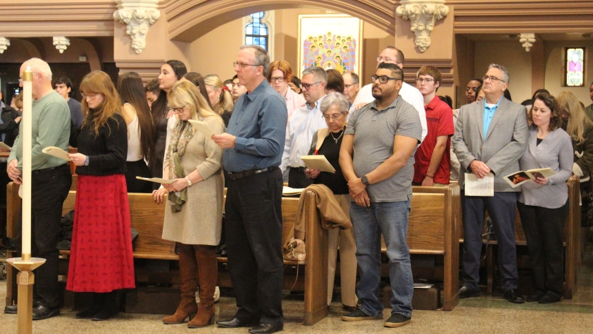 A group of candidates and their sponsors from Holy Family Parish in LaPorte and other parishes in the Diocese of Gary participate in the Rite of Call to Continuing Conversion at the Cathedral of the Holy Angels on Nov. 23. Deacon Dennis Guernsey announced each candidate’s name as Bishop Robert J. McClory recognized and accepted their intent to fully join the Catholic Church. (Marlene A. Zloza photo)
