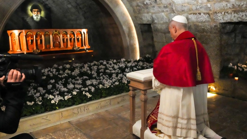 Pope Leo XIV prays in silence before the tomb of St. Charbel Makhlouf at the Monastery of St. Maron in Annaya, Lebanon, Dec. 1, 2025. (CNS photo/Lola Gomez)