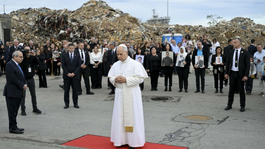 Standing amid the rubble and with the loved ones of people killed behind him, Pope Leo XIV prays at a memorial marking the site of a deadly explosion in 2020 at the port in Beirut Dec. 2, 2025. (CNS photo/Vatican Media)