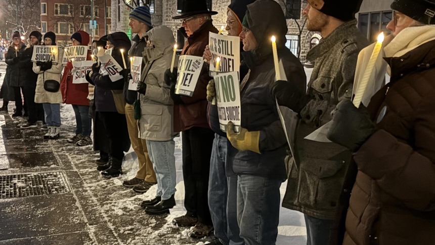 People attend a candlelight vigil outside the Sen. John H. Hughes Office Building in downtown Syracuse, N.Y., Dec. 4, 2025, to speak out against a controversial bill that, should it become law, would allow physicians to assist terminally ill adults as young as age 18 to die by suicide. (OSV News photo/Tami S. Scott, The Catholic Sun)