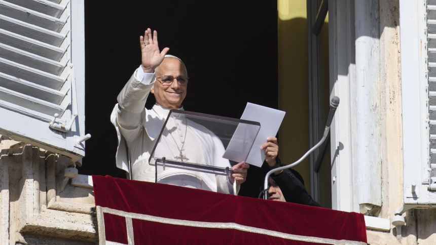 Pope Leo XIV waves to visitors gathered in St. Peter's Square at the Vatican for the recitation of the Angelus prayer Dec. 7, 2025. (CNS photo/Vatican Media)