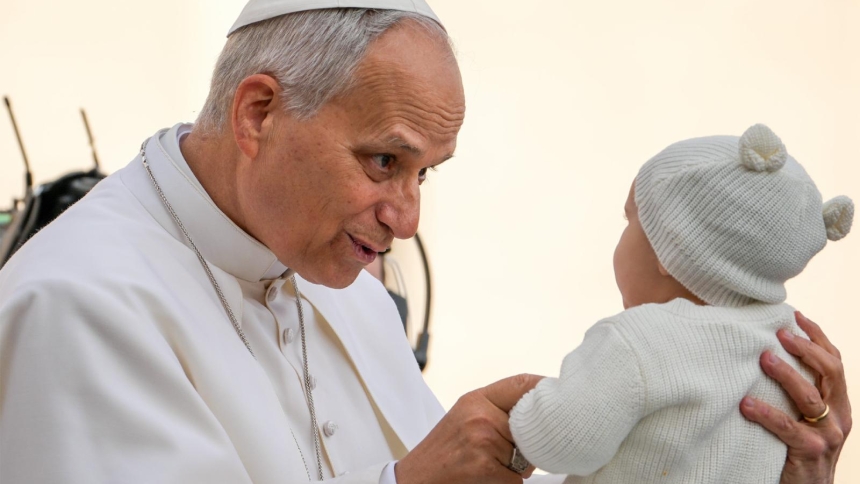 Pope Leo XIV greets a child from the popemobile as he rides around St. Peter's Square at the Vatican before his weekly general audience Dec. 17, 2025. In his message for World Peace Day, the pope encouraged everyone to contribute to peace by being kind. "Goodness is disarming. Perhaps this is why God became a child," he wrote. (CNS photo/Lola Gomez)
