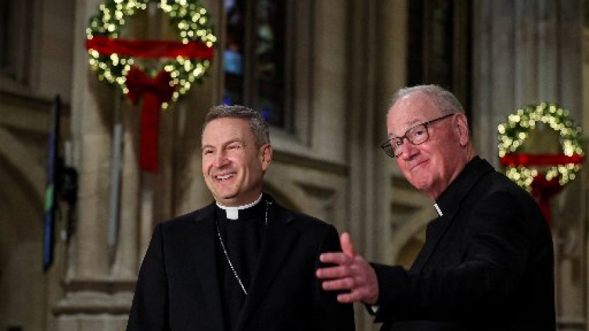 Archbishop Ronald A. Hicks and New York Cardinal Timothy M. Dolan smile during a news conference at St. Patrick’s Cathedral in New York City Dec. 18, 2025, after Pope Leo XIV accepted the resignation of Cardinal Dolan, and appointed Archbishop Hicks as his successor. Archbishop Hicks was previously the bishop of Joliet, Ill. (OSV News photo/Brendan McDermid, Reuters)