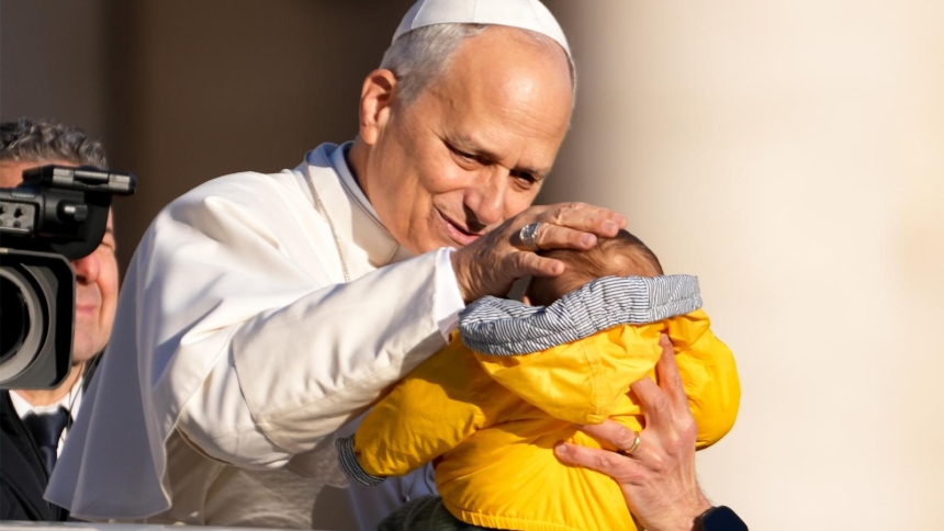 Pope Leo XIV greets a child from the popemobile as he rides around St. Peter's Square at the Vatican before his weekly general audience Dec. 31, 2025. (CNS photo/Lola Gomez)