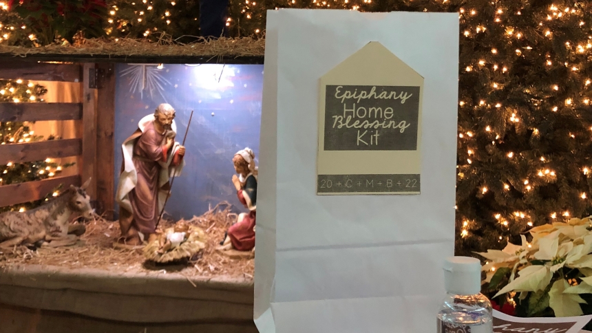 Father Ivan Alatorre and Father Jeff Burton filled 500 holy water bottles and then volunteers stuffed Home Blessing Kit bags the week before the Feast of the Epiphany. (Provided photo)