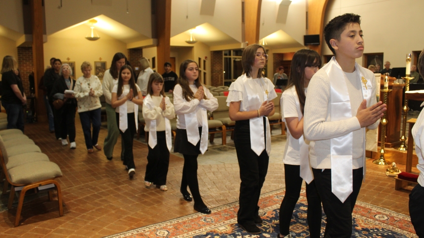 The Holy Spirit Youth Choir participates in the Eucharistic Procession at the Winfield church on the final day of the 40 Hours of Devotion hosted by the One Catholic Family parishes on the weekend of Nov. 21-23. The services began on Friday at St. Helen in Hebron, continued on Saturday at St. Mary in Kouts, and concluded on Sunday at Holy Spirit. (Marlene A. Zloza photo)