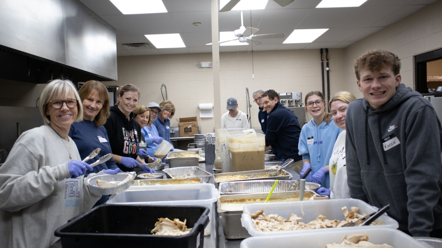 Parishioners from St. John the Evangelist and Our Lady Queen of Martyrs proportion meals for delivery Nov. 26. (Provided photo)