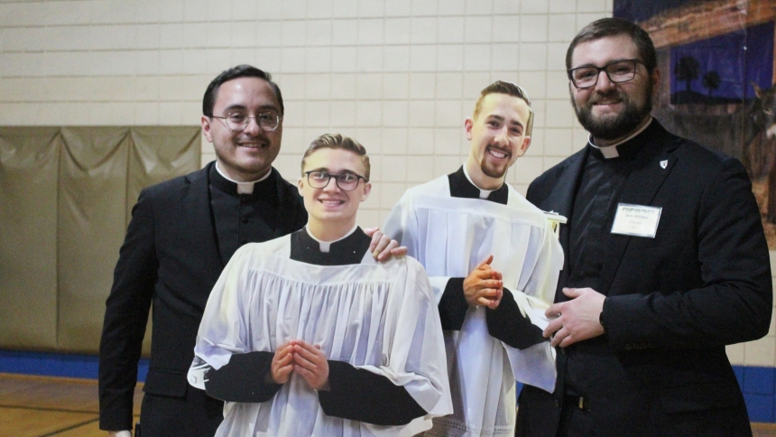 The Serra Club made sure that the two Diocese of Gary seminarians studying in Rome had a presence at its annual Seminarian Christmas Party on Dec. 26 at St. Bridget in Hobart. Before they took their places at their dinner tables, cutouts of Gianni DiTola and Ryan Pierce were “greeted” by Father Ivan Alatorre (left) and Deacon Will O’Donnell. (Marlene A. Zloza photo)