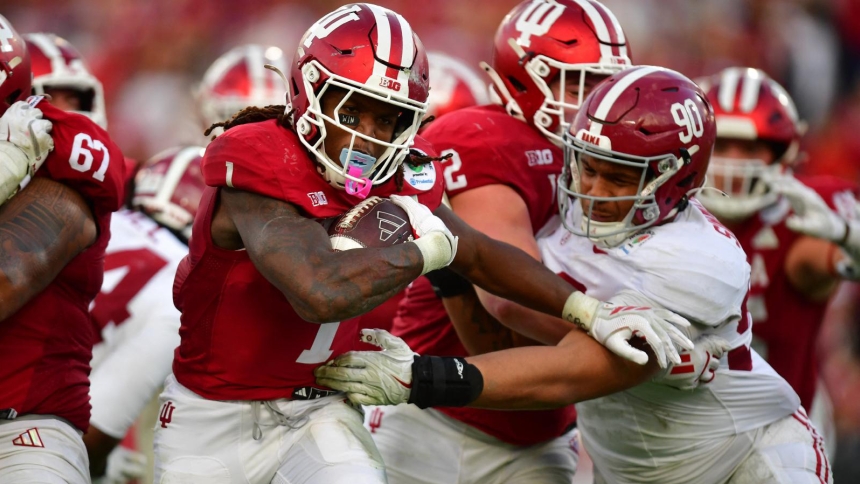 Indiana Hoosiers running back Roman Hemby (1) runs to score a touchdown against Alabama Crimson Tide defensive lineman London Simmons (90) in the second half of the 2026 Rose Bowl and quarterfinal game of the College Football Playoff on New Year's Day at Rose Bowl Stadium in Pasadena, Calif. The Hoosiers defeated Alabama 38-3. (OSV News photo/Mandatory Credit: (OSV News photo/Gary A. Vasquez-Imagn Images via Reuters)
