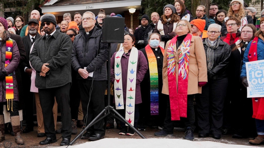 Religious leaders, including Father Dale Korogi, pastor of Ascension Catholic Church in Minneapolis, next to a broadcast speaker, attend an interfaith news conference in Minneapolis Jan. 8, 2026, at the scene of the fatal shooting of Renee Nicole Good by a U.S. Immigration and Customs Enforcement agent. The 37-year-old woman was shot in her car Jan. 7, according to local and federal officials. (OSV News photo/Tim Evans, Reuters)