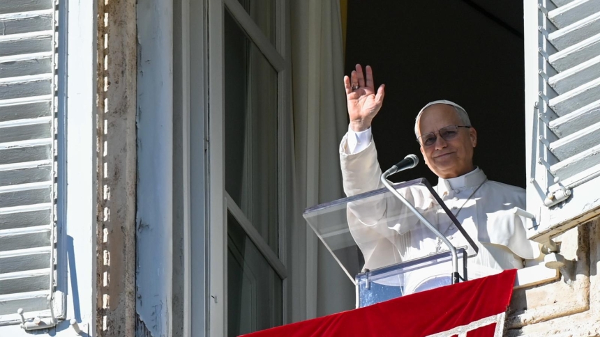 Pope Leo XIV greets visitors in St. Peter's Square at the Vatican as they gather to pray the Angelus, Jan. 11, 2026. (CNS photo/Vatican Media)