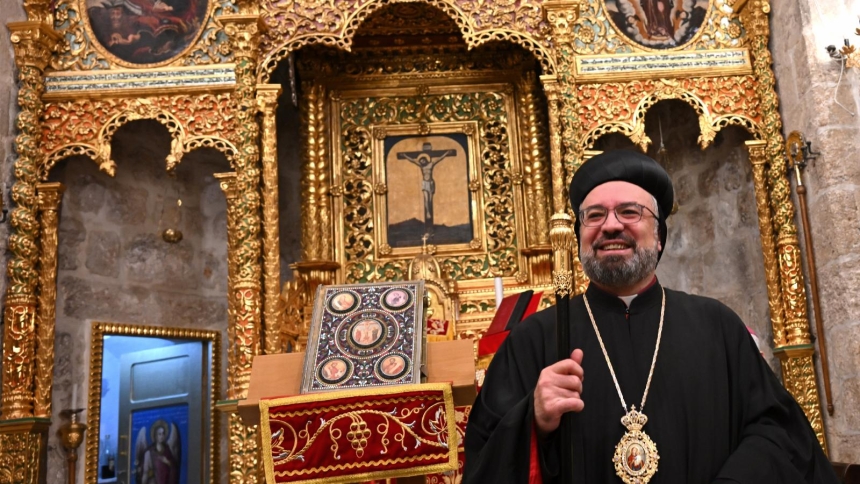 Archbishop Mor Anthimos Jack Yakoub, the Syriac Orthodox patriarchal vicar for Jerusalem, Jordan and the Holy Land, stands in front of the restored ancient altar in the Syriac Orthodox Patriarchal Monastery of St. Mark in Jerusalem Jan. 11, 2026, after an intensive two-year restoration process. (OSV News photo/Debbie Hill)