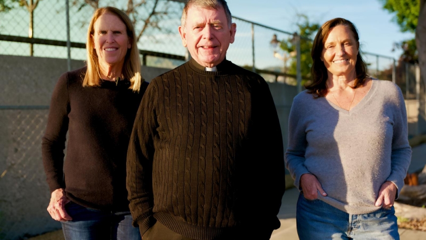 Sue Kohl, Msgr. Liam Kidney and Paola Sessarego during a visit to the site of Corpus Christi Church in Pacific Palisades, Calif., in Dec. 2025. Behind them are multiple rebuilt homes under construction following the devastating fires. Tens of thousands of people were impacted after the Pacific Palisades and Eaton blazes began Jan. 7, 2025. (OSV News photo/Reese Cuevas, Angelus)