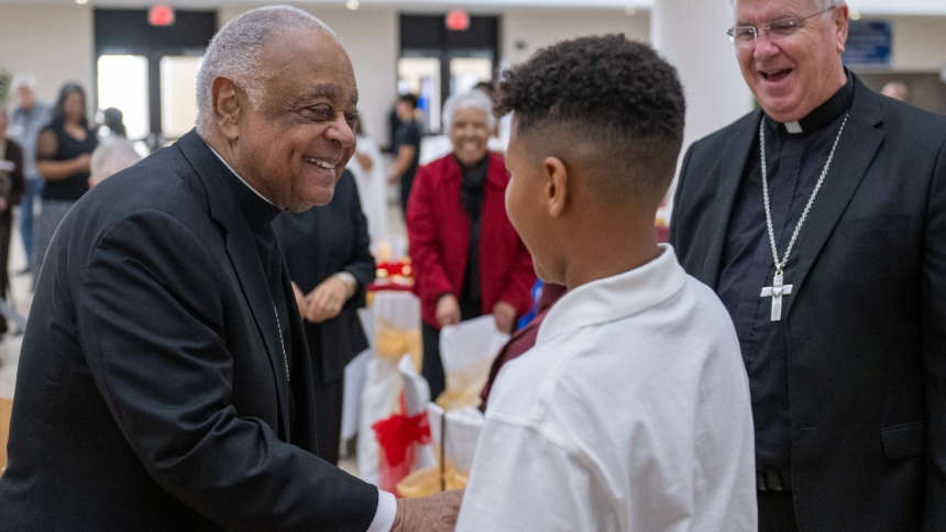 Cardinal Wilton D. Gregory, the first African American cardinal and now retired archbishop of Washington, greets a young man after concelebrating the Diocese of Phoenix's annual Rev. Dr. Martin Luther King Jr. Mass Jan. 17, 2026, at Xavier College Preparatory High School's Chapel of Our Lady in central Phoenix. Smiling at right is Phoenix Bishop John P. Dolan. (OSV News photo/Brett Meister, courtesy Diocese of Phoenix)