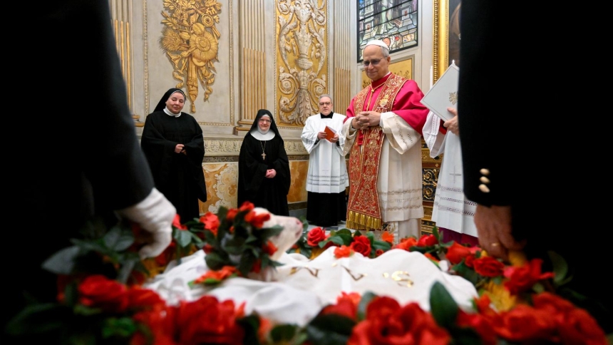 Pope Leo XIV blesses two lambs in the Urban VIII Chapel at the Vatican Jan. 21, 2026, the feast of St. Agnes. The lambs are bound and placed in baskets to prevent them from running away. The wool from the lambs is used to make the palliums worn by new metropolitan archbishops. (CNS photo/Vatican Media)