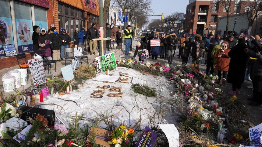 People gather at a makeshift memorial in Minneapolis Jan. 25, 2026, at the site where a man was fatally shot by federal agents trying to detain him Jan. 24. Archbishop Bernard A. Hebda of St. Paul and Minneapolis, along with other Church leaders, have called for peace amid growing tensions. (OSV News photo/Tim Evans, Reuters)