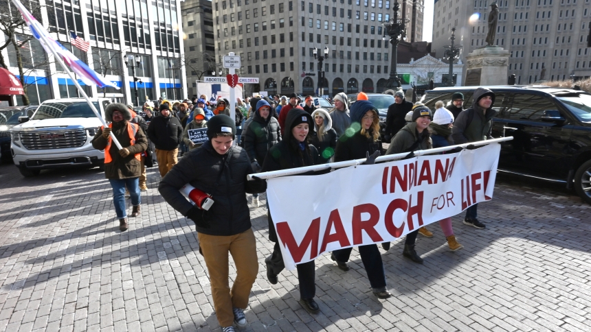 The leading throng of mainly Catholic youth carry a pro-life banner near Monument Circle during the Indiana March for Life on Jan. 22 in Indianapolis. The state march, in its eighth year, is a localized version of the National March for Life, which, since 1974, has brought together millions of concerned Americans who wish to publicly proclaim the Gospel of Life – to establish legal protections for the unborn from abortion and promote a womb-to-tomb respect for human life. (Anthony D. Alonzo photo)