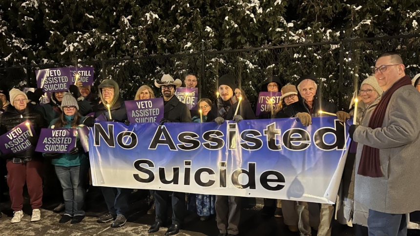 Opponents of New York state's proposed assisted suicide bill stand outside the governor's mansion in Albany Dec. 3, 2025, for a candlelight vigil urging Gov. Kathy Hochul, a Catholic, to veto the bill passed by the Legislature June 9. Hochul signed the measure into law Feb. 6, 2026. (OSV News photo/Emily Benson, The Evangelist)