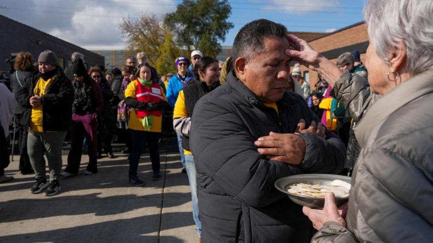 A man receives a blessing during an outdoor Mass Nov. 1, 2025, held outside the Immigration and Customs Enforcement facility in Broadview, Ill. U.S. District Judge Robert W. Gettleman in Chicago granted a preliminary injunction Feb. 12 that allows clergy, religious and Catholic social justice advocates to enter the ICE facility on Ash Wednesday Feb. 18 to offer ashes and holy Communion to detained Catholics. (OSV News photo/Leah Millis, Reuters)