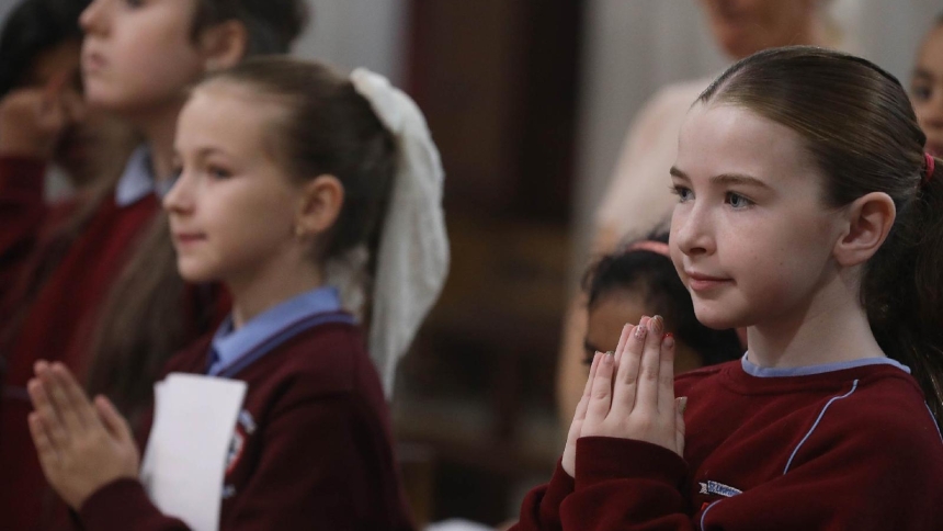 Young choir members pray during a Mass at Dublin's St. Mary's Pro Cathedral Nov. 14, 2025, marking the bicentenary of the church's dedication in 1825 and the feast of the city's patron, St. Laurence O'Toole. The same day Pope Leo XIV officially designated the pro-cathedral as the Dublin Archdiocese's cathedral, ending its 200-year status as a temporary (pro) church. Speaking at a book launch in Dublin in mid-February 2026, Bishop Niall Coll of Raphinoe said young Catholics born after 1995 want doctrinal cla