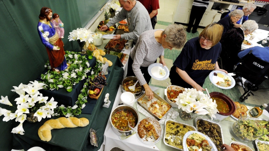 Parishioners of St. John the Evangelist Church in Spencerport, N.Y., are pictured in a file photo taking part in a meatless buffet that was part of the church's St. Joseph's Table. The celebration to mark St. Joseph's feast day dates back to Sicily in the Middle Ages when the saint was called on to end a famine. (OSV News photo/Mike Crupi, Catholic Courier)