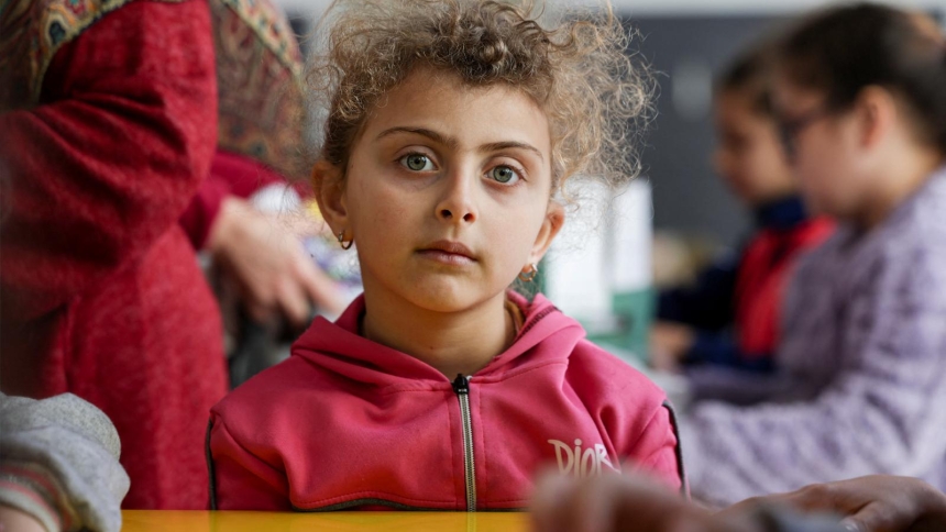 A child looks on as she and other children take part in activities March 11, 2026, at a school sheltering displaced civilians after an escalation between Hezbollah and Israel, amid the U.S. and Israel-Iran war in Beirut. (OSV News photo/Khalil Ashawi, Reuters)