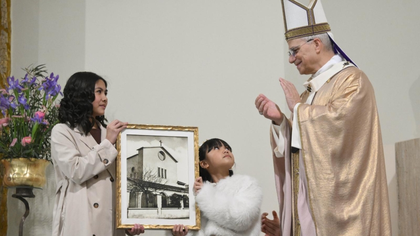  Pope Leo XIV greets two children giving him a gift during a parish visit to the Church of the Sacred Heart of Jesus in Rome, Italy, March 15, 2026. (CNS photo/Vatican Media)