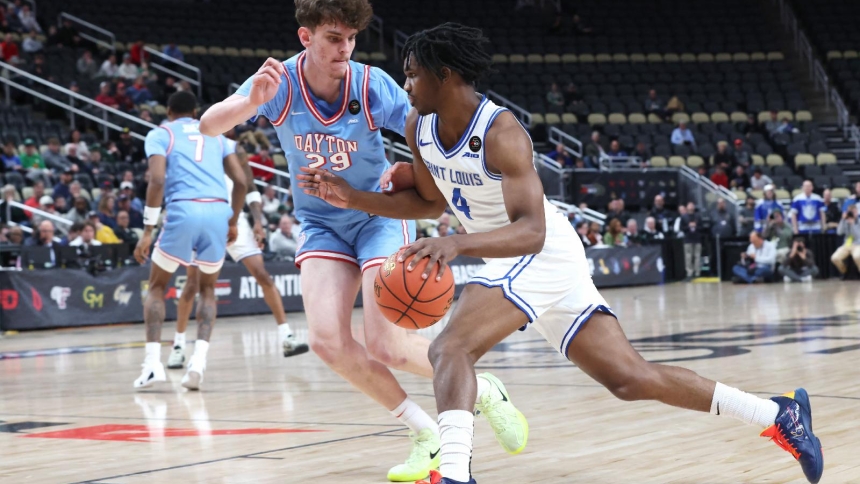St. Louis Billikens guard Amari McCottry drives to the basket against Dayton Flyers forward Amael L'etang during the first half in an Atlantic 10 Conference Tournament Semifinal game at PPG Paints Arena in Pittsburgh, March 14, 2026. (OSV News photo/Charles LeClaire-Imagn Images, Reuters) 
