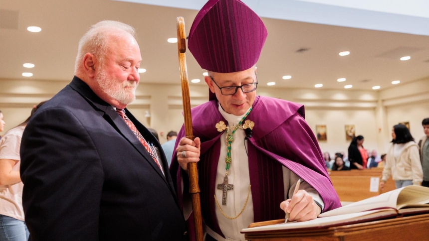 Bishop Barry C. Knestout of Richmond, Va., signs the Book of the Elect for catechist Donald Brown at the Diocese of Richmond's Rite of Election at Our Lady of Nazareth in Roanoke, Va., March 1, 2026. (OSV News photo/Ryan Hunt, Diocese of Richmond)