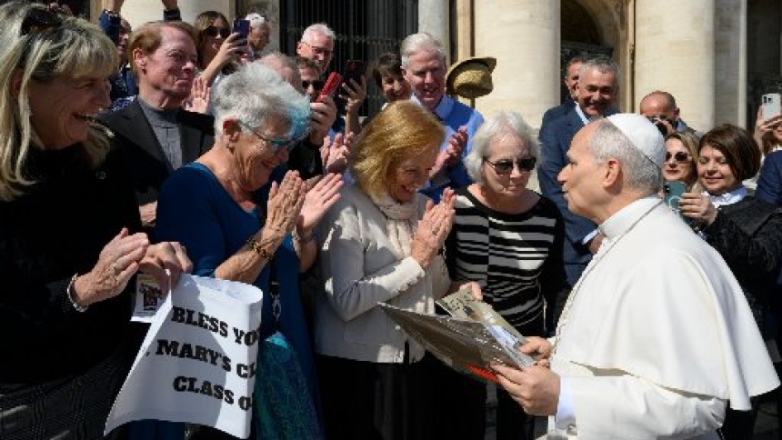 Pope Leo XIV meets with former classmates who graduated from the lower school of St. Mary of the Assumption in Chicago in 1969 after the general audience in St. Peter's Square at the Vatican March 18, 2026. (CNS photo/Vatican Media)