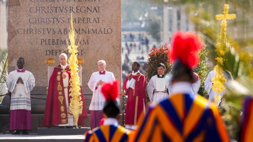 Pope Leo XIV holds a palm branch as he celebrates the Palm Sunday Mass in St. Peter's Square at the Vatican, March 29, 2026. (CNS photo/Lola Gomez)