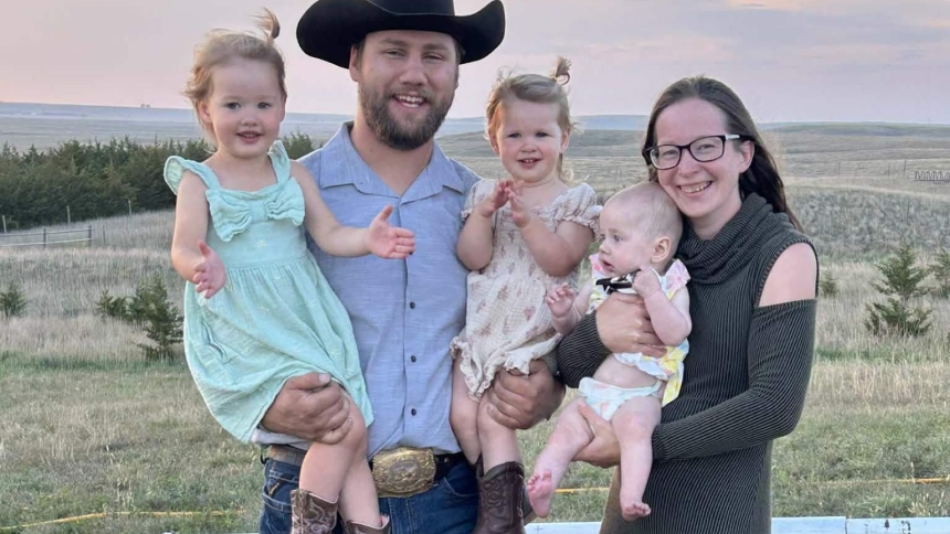 Wyatt and Andrea Artz, are pictured in an undated photo with their three children Roselyn, Adeline and Catherine outside their home in Gann Valley, S.D. As a fourth grader, Andrea Artz remembers praying that she would experience a Eucharistic miracle one day. She never imagined that, years later, she might witness one with her newborn daughter Catherine. (OSV News photo/courtesy Artz family)