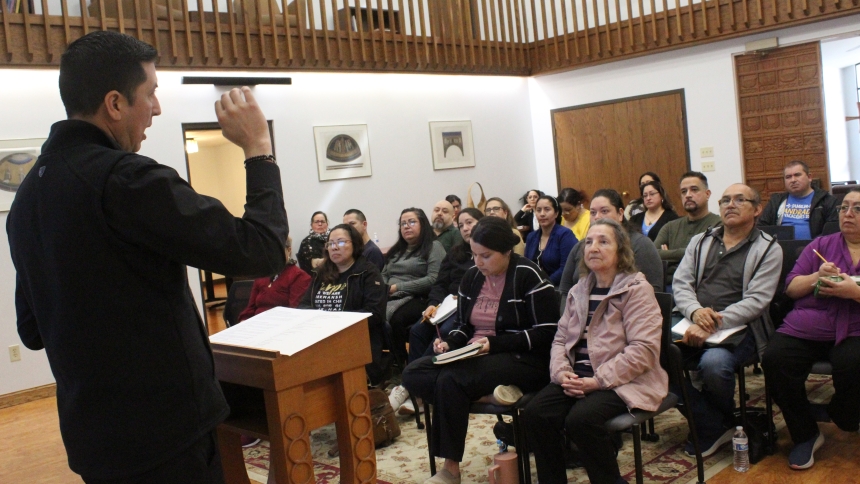 Father Roque Meraz, associate pastor at St. Paul in Valparaiso, explains the principles of Catholic Social Teaching in relation to civil laws during the Saturday Formation program on “Faith and Politics” at the Pastoral Center in Merrillville on March 21. He taught Spanish speakers while Father Jacob McDaniel simultaneously met with English-speaking attendees on the same topic. (Marlene A. Zloza photo)