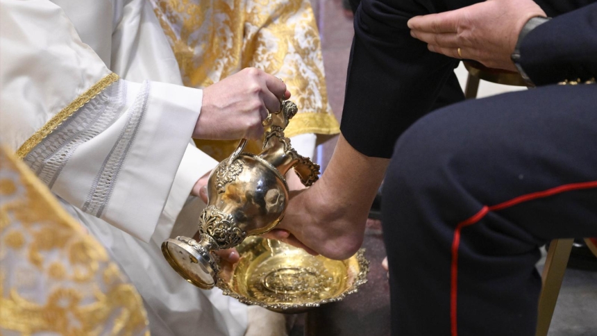 Cardinal Mauro Gambetti, archpriest of St. Peter's Basilica, washes the feet of laypeople during the Holy Thursday Mass of the Lord's Supper at the Altar of the Chair in the Vatican April 17, 2025. (CNS photo/Vatican Media)
