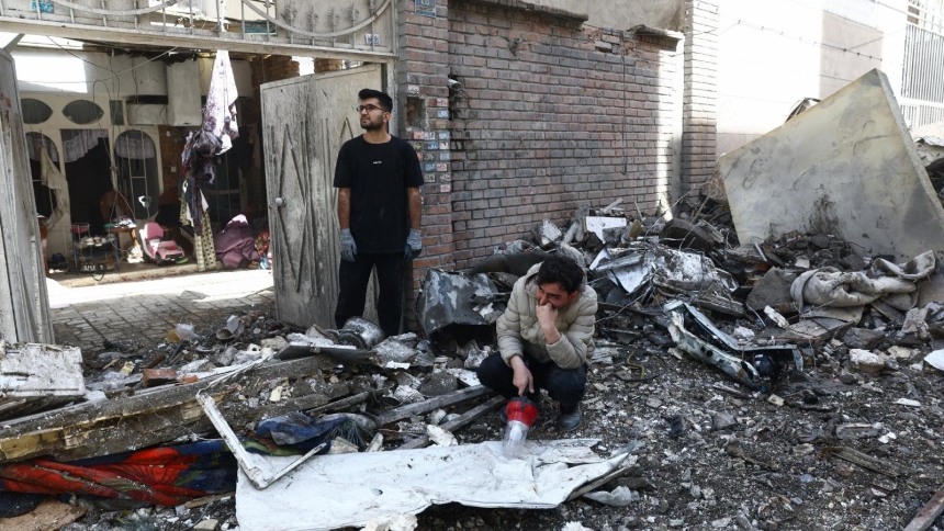 People react at the site of a residential building in Tehran, Iran, March 27, 2026, that was damaged by a strike amid the U.S.-Israeli war with Iran. (OSV News photo/Majid Asgaripour, West Asia News Agency via Reuters)