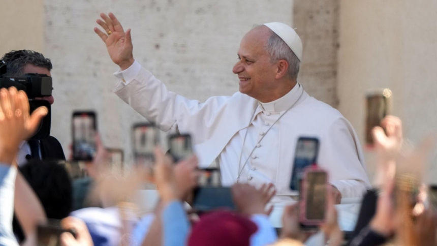 Pope Leo XIV greets people from the popemobile after appearing on the central balcony of St. Peter’s Basilica at the Vatican after Easter Mass April 5, 2026. (CNS photo/Lola Gomez)