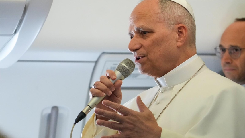 Pope Leo XIV speaks to reporters aboard the papal flight from Rome, Italy, to Algeria April 13, 2026. (CNS photo/Lola Gomez)