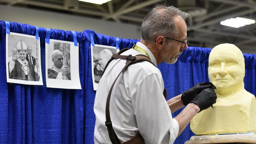 Butter sculptor Gerry Kulzer works on creating a bust of Pope Leo XIV out of the dairy staple April 7, 2026, during the 2026 National Catholic Educational Association Convention in Minneapolis, held April 7-9. (OSV News photo/Dianne Towalski, The Central Minnesota Catholic)