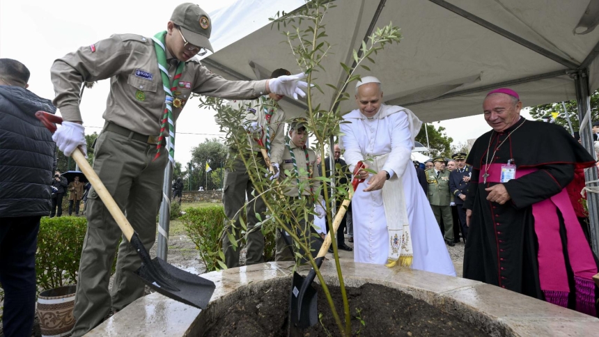 Pope Leo XIV is assisted by a Boy Scout as he visits the archaeological site of Hippo Regius in Annaba, Algeria, April 14, 2026. At right is Bishop Michel Guillaud of Constantine-Hippone in Algeria. (OSV News photo/Simone Risoluti, Vatican Media)