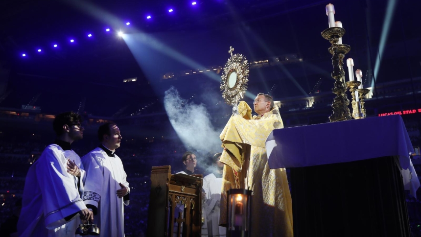 Bishop Andrew H. Cozzens of Crookston, Minn., chairman of the board of the National Eucharistic Congress, blesses pilgrims July 17, 2024, during adoration at the opening revival night of the 10th National Eucharistic Congress at Lucas Oil Stadium in Indianapolis. (OSV News photo/Bob Roller)