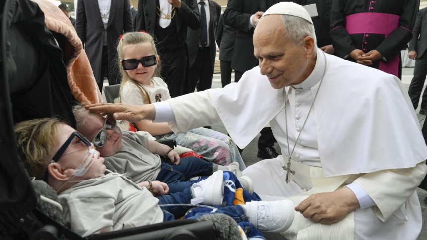 Pope Leo XIV blesses children with disabilities as he arrives to lead his weekly general audience in St. Peter's Square at the Vatican May 13, 2026. (OSV News photo/Simone Risoluti, Vatican Media)