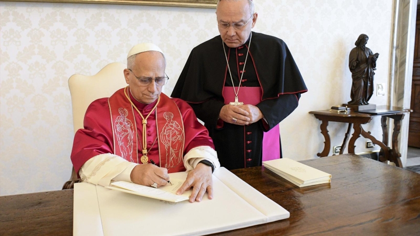 Pope Leo XIV signs his first apostolic exhortation, "Dilexi Te" ("I Have Loved You"), in the library of the Apostolic Palace at the Vatican Oct. 4, 2025. His first encyclical, "Magnifica Humanitas," addressing artificial intelligence and the protection of human dignity, will be published May 25, 2026, the Vatican announced May 18. (CNS photo/Vatican Media)