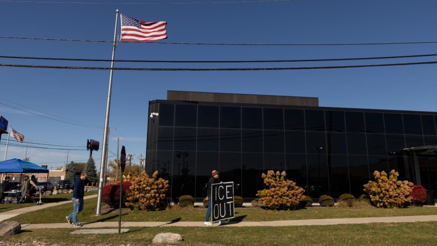 A demonstrator holds a sign that reads "ICE out" during a protest against immigration actions outside the Broadview ICE facility in Chicago Nov. 7, 2025. Leaders of the Coalition for Spiritual and Public Leadership said that with a judge's order May 15, 2026, some of their members are now allowed into the Broadview ICE facility to minister to detainees daily. (OSV News photo/Carlos Barria, Reuters)