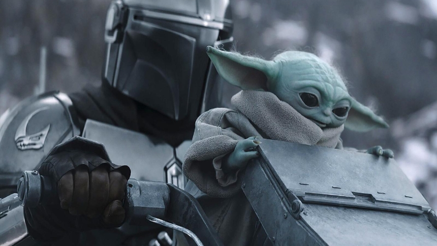 Mandalorian (Pedro Pascal) and Grogu are pictured in a scene from the movie "The Madalorian and Grogu." The Motion Picture Association rating is PG-13 -- parents are strongly cautioned. Some material may be inappropriate for children under 13. (OSV News photo/Disney)
