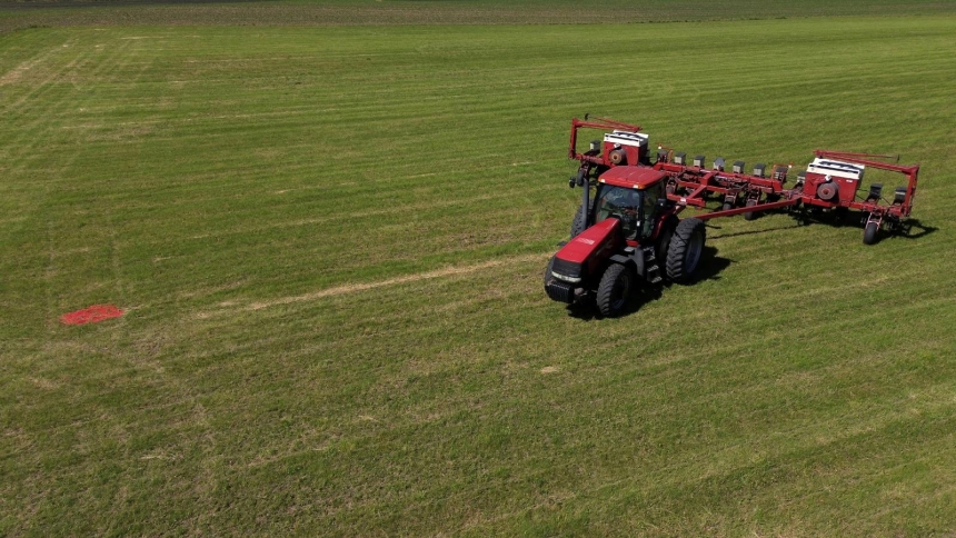 A drone view shows Mark Tuttle's tractor and soybean planter parked on his soy farm in Somonauk, Ill., May 30, 2024. On April 14, 2026, the American Farm Bureau Federation reported, "Rising input costs tied to the conflict in the Middle East are adding strain to an already challenging farm economy." (OSV News photo/Jim Vondruska, Reuters)